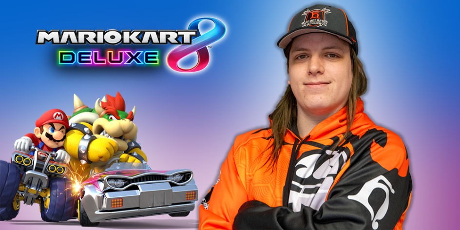 Corbin is a white person with sandy-brown long hair. They are wearing a hat with the Heidelberg Esports logo and the Heidelberg Esports hoodie with the student prince logo on the chest and the h on the sleeve. They are superimposed on a gradient blue and purple background, with the mario kart 8 deluxe logo and mario and bowser in cars competing superimposed to their left.