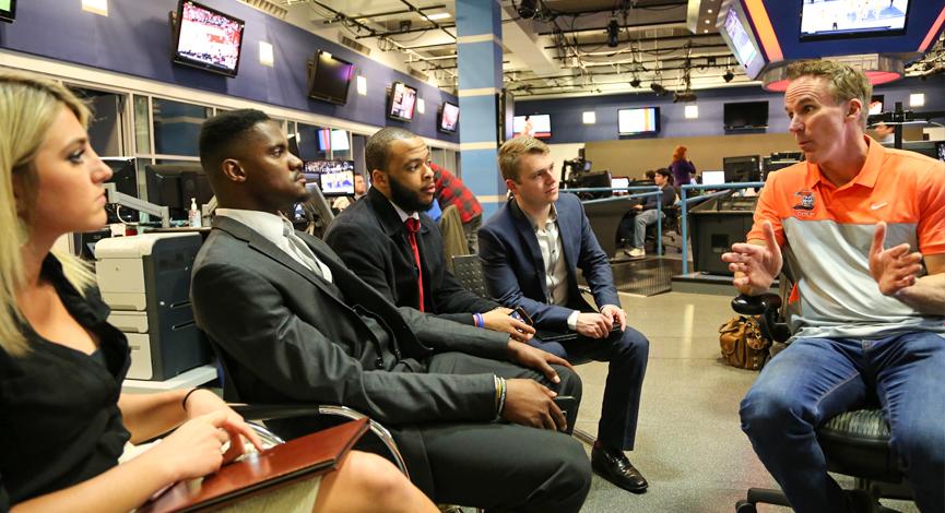 Four students pictured with John Buccigross at ESPN.