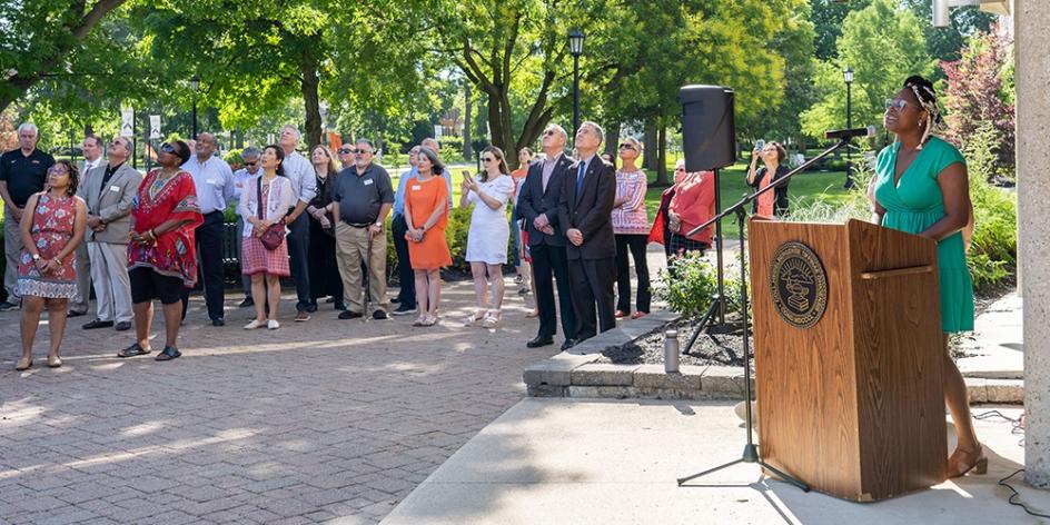 Rising junior Zaria Keys sings Lift Every Voice and Sing as the Juneteenth flag is raised Friday at Beeghly Library.