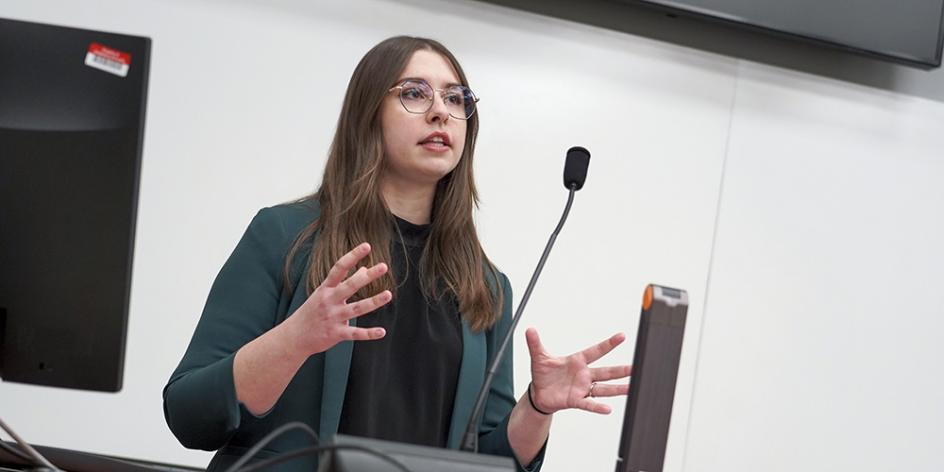 Student co-organizer Emma Baughman presents her research at the 29th Minds@Work Student Research Conference.