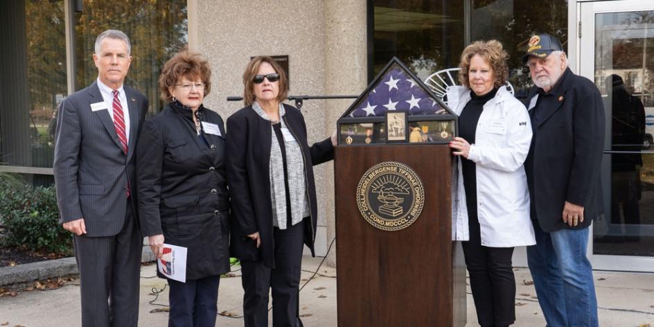 The family of Jim Tangeman '67 presented to Heidelberg the flag that draped his coffin and his Vietnam service medals.